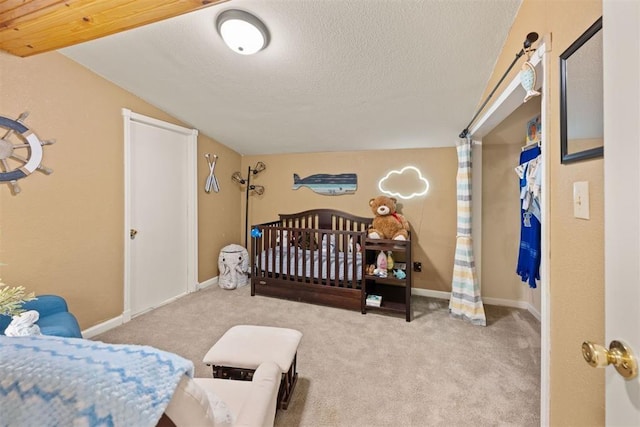 20302 Kings Rd, Shawnee, OK 74801 - bedroom with vaulted ceiling, carpet, a textured ceiling, and baseboards