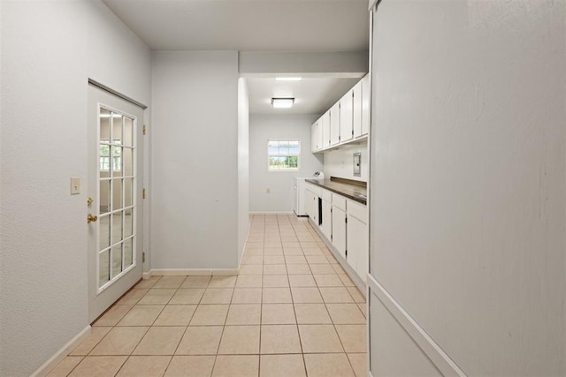 20302 Kings Rd, Shawnee, OK 74801 - kitchen featuring white cabinetry, light tile patterned floors, and baseboards
