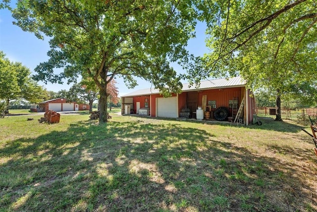 20302 Kings Rd, Shawnee, OK 74801 - view of yard with a detached garage, a pole building, and an outdoor structure