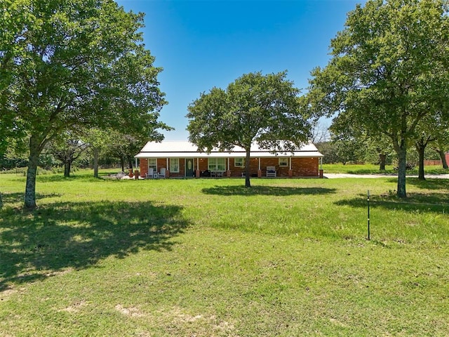 20302 Kings Rd, Shawnee, OK 74801 - view of front of property with covered porch and a front lawn