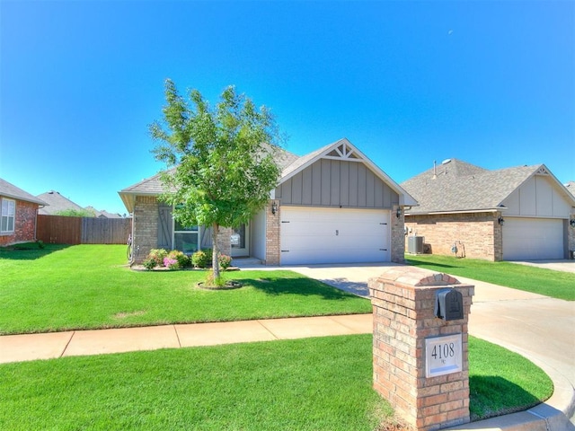 4108 NW 154th St, Edmond, OK 73013 - view of front facade featuring board and batten siding, driveway, a garage, cooling unit, and brick siding