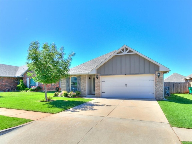 4108 NW 154th St, Edmond, OK 73013 - single story home featuring board and batten siding, an attached garage, driveway, brick siding, and roof with shingles