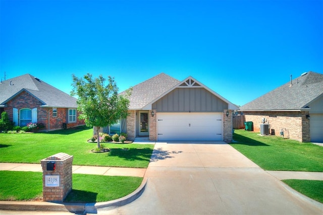4108 NW 154th St, Edmond, OK 73013 - view of front of house featuring board and batten siding, an attached garage, cooling unit, a front yard, and driveway