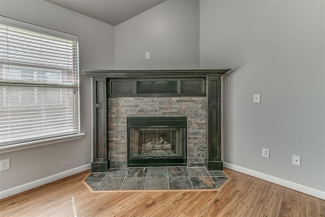 4108 NW 154th St, Edmond, OK 73013 - detailed view of wood finished floors, baseboards, and a fireplace with flush hearth