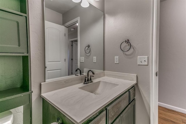 4108 NW 154th St, Edmond, OK 73013 - bathroom featuring vanity and wood finished floors