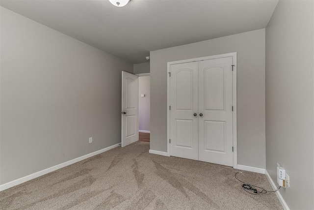 4108 NW 154th St, Edmond, OK 73013 - unfurnished bedroom featuring carpet flooring, baseboards, and a closet