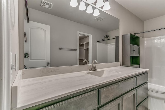 4108 NW 154th St, Edmond, OK 73013 - bathroom featuring vanity, toilet,  shower combination, and a spacious closet