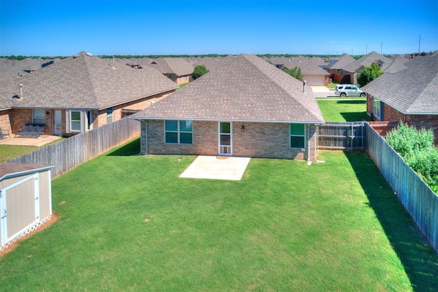 4108 NW 154th St, Edmond, OK 73013 - rear view of house with brick siding, a patio area, a residential view, and roof with shingles
