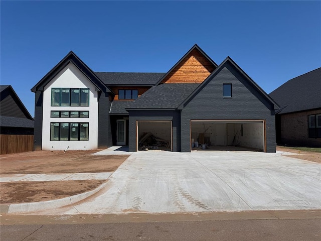 modern farmhouse style home featuring driveway and brick siding