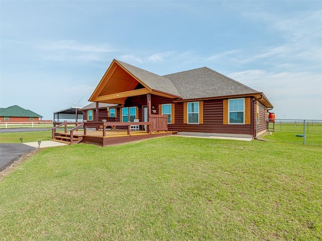 1466 County Rd 1188, Tuttle, OK 73089 - back of property with roof with shingles, a deck, and log veneer siding