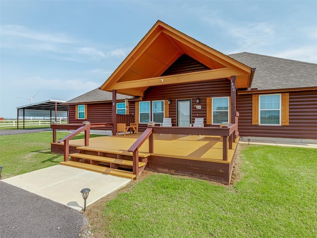1466 County Rd 1188, Tuttle, OK 73089 - back of house with a shingled roof, a yard, faux log siding, and a wooden deck