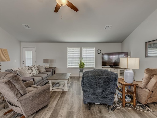 1466 County Rd 1188, Tuttle, OK 73089 - living area featuring a ceiling fan, wood finished floors, and vaulted ceiling
