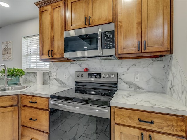 1466 County Rd 1188, Tuttle, OK 73089 - kitchen with appliances with stainless steel finishes, decorative backsplash, brown cabinets, and marble finish floors