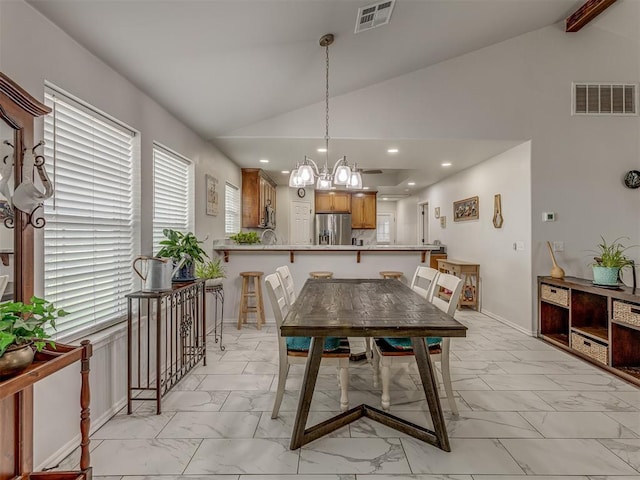 1466 County Rd 1188, Tuttle, OK 73089 - dining area featuring light marble finish flooring, a chandelier, recessed lighting, and high vaulted ceiling