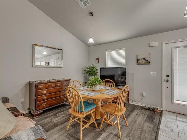 1466 County Rd 1188, Tuttle, OK 73089 - dining area with vaulted ceiling and light wood-style floors