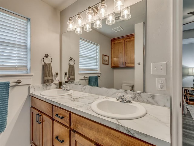 1466 County Rd 1188, Tuttle, OK 73089 - bathroom with double vanity and toilet