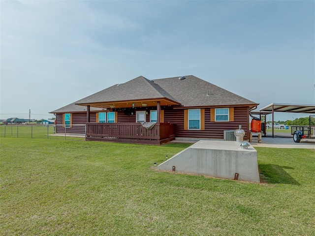 1466 County Rd 1188, Tuttle, OK 73089 - back of property featuring a shingled roof and a wooden deck