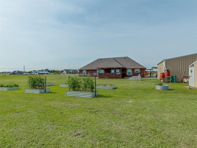 1466 County Rd 1188, Tuttle, OK 73089 - view of grassy yard with a vegetable garden