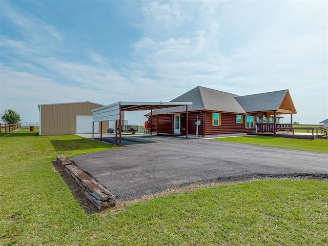 1466 County Rd 1188, Tuttle, OK 73089 - view of outbuilding with a carport and asphalt driveway