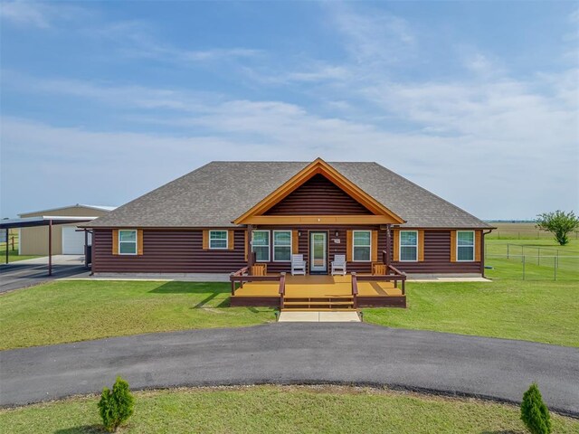 1466 County Rd 1188, Tuttle, OK 73089 - cabin with roof with shingles, a carport, covered porch, and asphalt driveway