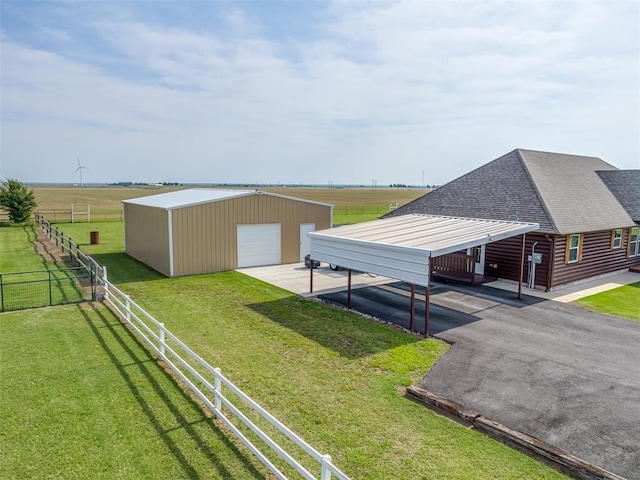 1466 County Rd 1188, Tuttle, OK 73089 - view of yard featuring an outbuilding, a garage, and driveway