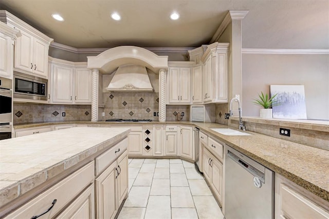 14812 Maplelake Dr, Edmond, OK 73013 - kitchen featuring stainless steel appliances, a sink, ornamental molding, light countertops, and recessed lighting