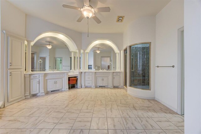 14812 Maplelake Dr, Edmond, OK 73013 - full bathroom with ceiling fan, ornate columns, a stall shower, marble look tile flooring, and vanity