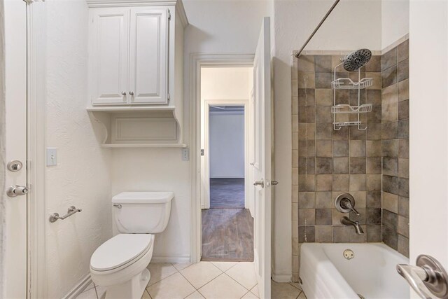 14812 Maplelake Dr, Edmond, OK 73013 - full bath with tile patterned floors, toilet,  shower combination, and baseboards