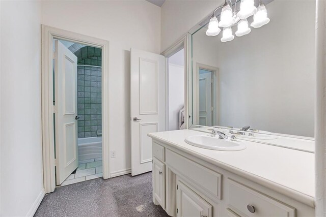 14812 Maplelake Dr, Edmond, OK 73013 - bathroom with a chandelier, vanity, and baseboards