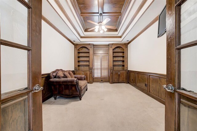 14812 Maplelake Dr, Edmond, OK 73013 - sitting room with ornamental molding, a wainscoted wall, light colored carpet, a ceiling fan, and a raised ceiling