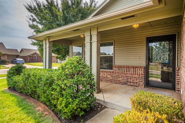 2702 Sharpish Way, Norman, OK 73069 - property entrance with brick siding and covered porch