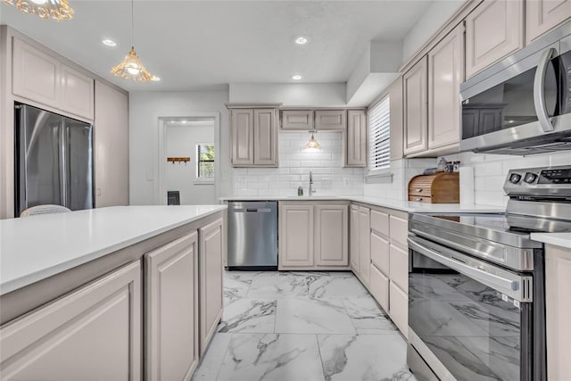 3223 Northridge Dr, Purcell, OK 73080 - kitchen featuring appliances with stainless steel finishes, healthy amount of natural light, a sink, light countertops, and recessed lighting