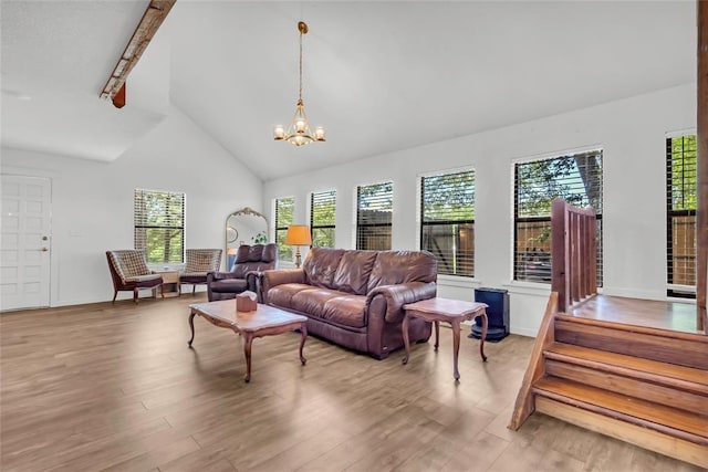 3223 Northridge Dr, Purcell, OK 73080 - living room with high vaulted ceiling, wood finished floors, plenty of natural light, a chandelier, and beamed ceiling