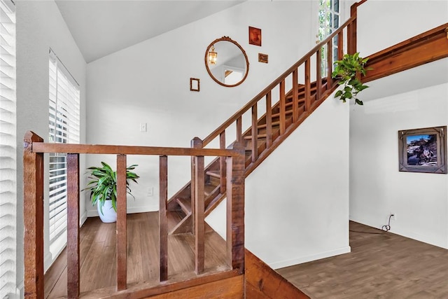 3223 Northridge Dr, Purcell, OK 73080 - stairway with wood finished floors, baseboards, and high vaulted ceiling