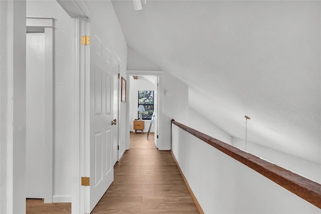 3223 Northridge Dr, Purcell, OK 73080 - corridor featuring vaulted ceiling, wood finished floors, and baseboards