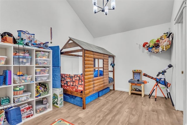 3223 Northridge Dr, Purcell, OK 73080 - recreation room with a chandelier, wood finished floors, lofted ceiling, and baseboards