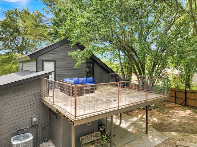 3223 Northridge Dr, Purcell, OK 73080 - rear view of house featuring central air condition unit, a wooden deck, a patio area, fence, and an outdoor living space