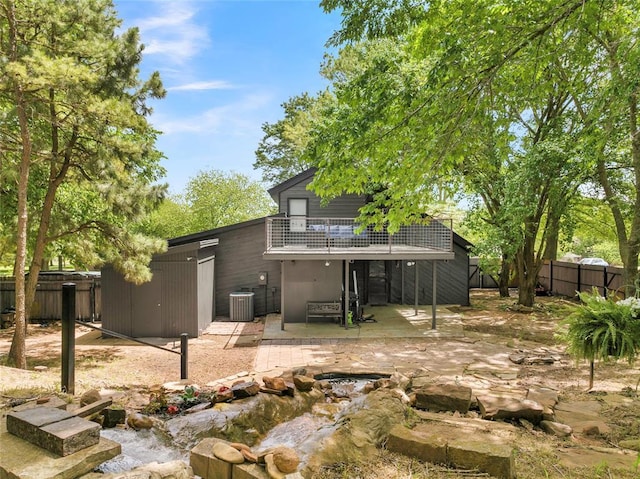3223 Northridge Dr, Purcell, OK 73080 - rear view of property with cooling unit, a patio, a fenced backyard, and a balcony