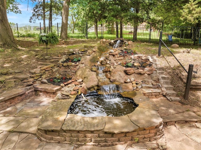 3223 Northridge Dr, Purcell, OK 73080 - view of yard featuring fence and a garden pond