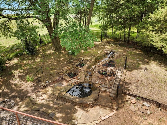 3223 Northridge Dr, Purcell, OK 73080 - fenced backyard with a garden pond