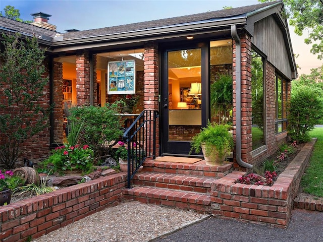 2901 NE 122nd St, Edmond, OK 73013 - view of exterior entry with brick siding and a chimney