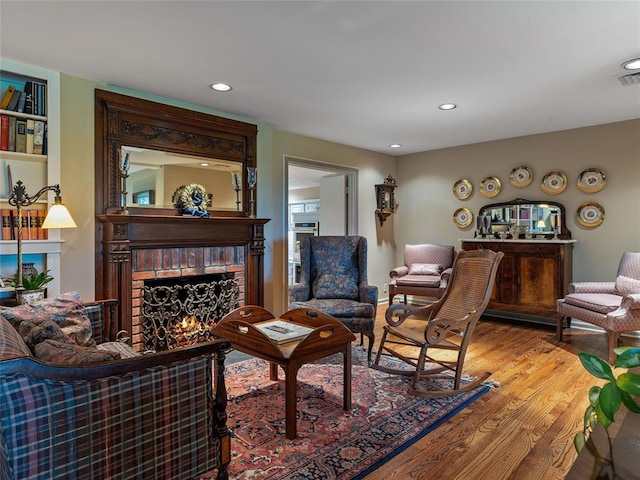 2901 NE 122nd St, Edmond, OK 73013 - living room featuring a fireplace, wood finished floors, and recessed lighting