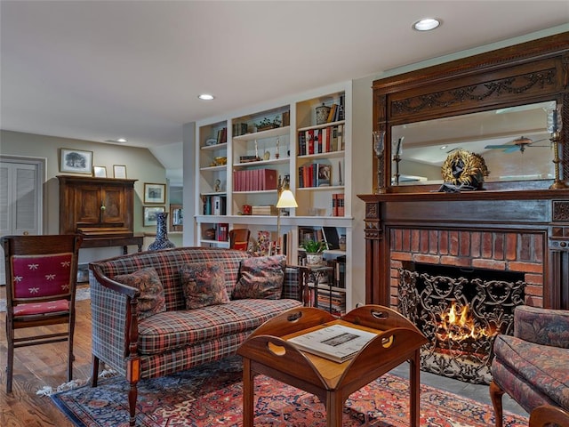 2901 NE 122nd St, Edmond, OK 73013 - living room featuring a fireplace, wood finished floors, and recessed lighting