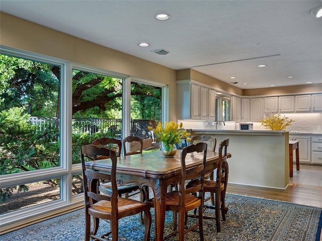 2901 NE 122nd St, Edmond, OK 73013 - dining space featuring light wood finished floors and recessed lighting