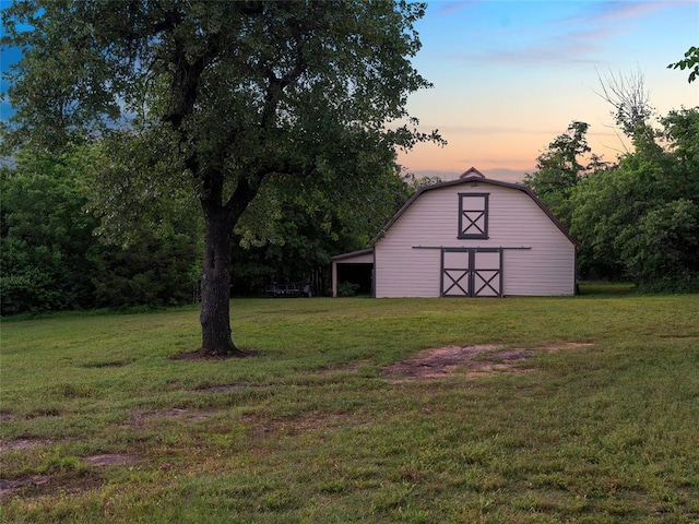 2901 NE 122nd St, Edmond, OK 73013 - yard at dusk featuring a barn, an outdoor structure, and a yard