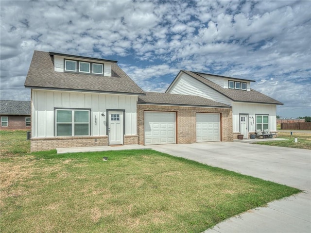 1867 Comice Dr, Newcastle, OK 73065 - craftsman-style house with board and batten siding, an attached garage, a front lawn, concrete driveway, and brick siding