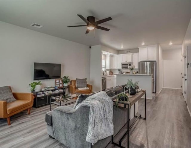 1867 Comice Dr, Newcastle, OK 73065 - living room with a ceiling fan, light wood-type flooring, and recessed lighting