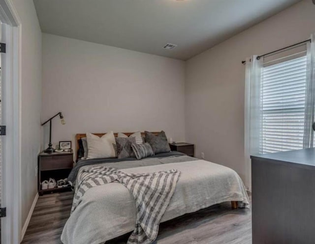 1867 Comice Dr, Newcastle, OK 73065 - bedroom featuring wood finished floors and baseboards