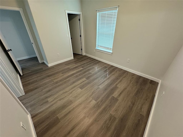 1867 Comice Dr, Newcastle, OK 73065 - unfurnished bedroom featuring dark wood finished floors and baseboards