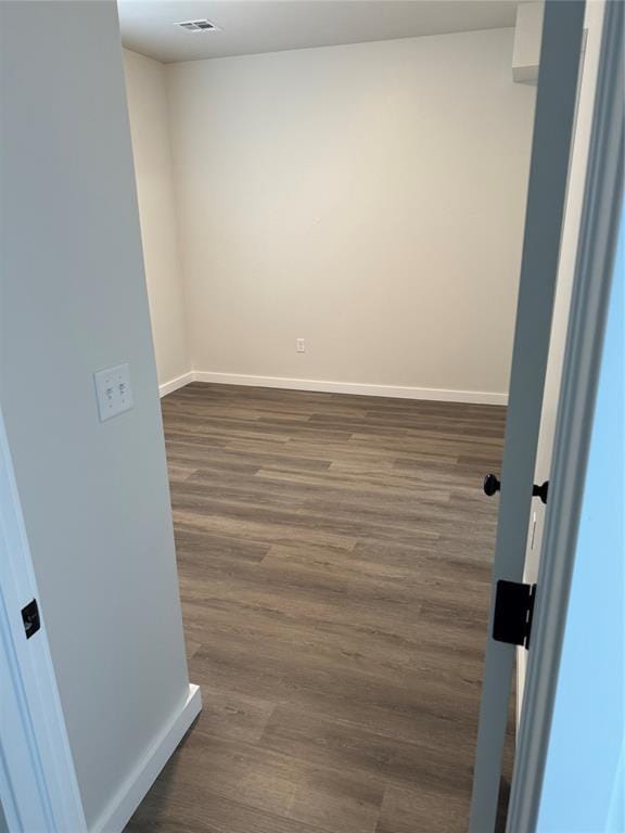 1867 Comice Dr, Newcastle, OK 73065 - empty room with dark wood-style floors and baseboards